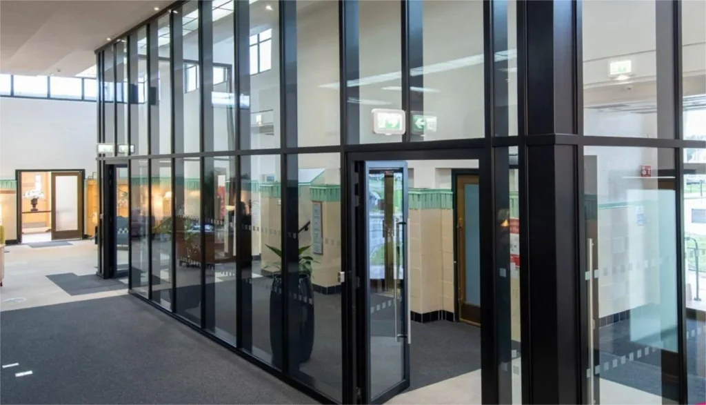 Certified fire-rated glass partition system ensuring integrity and thermal insulation for commercial safety